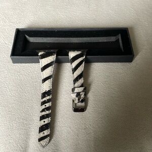 Apple watch band. New, never used. Zebra print and adjustable. Fits 38 mm.